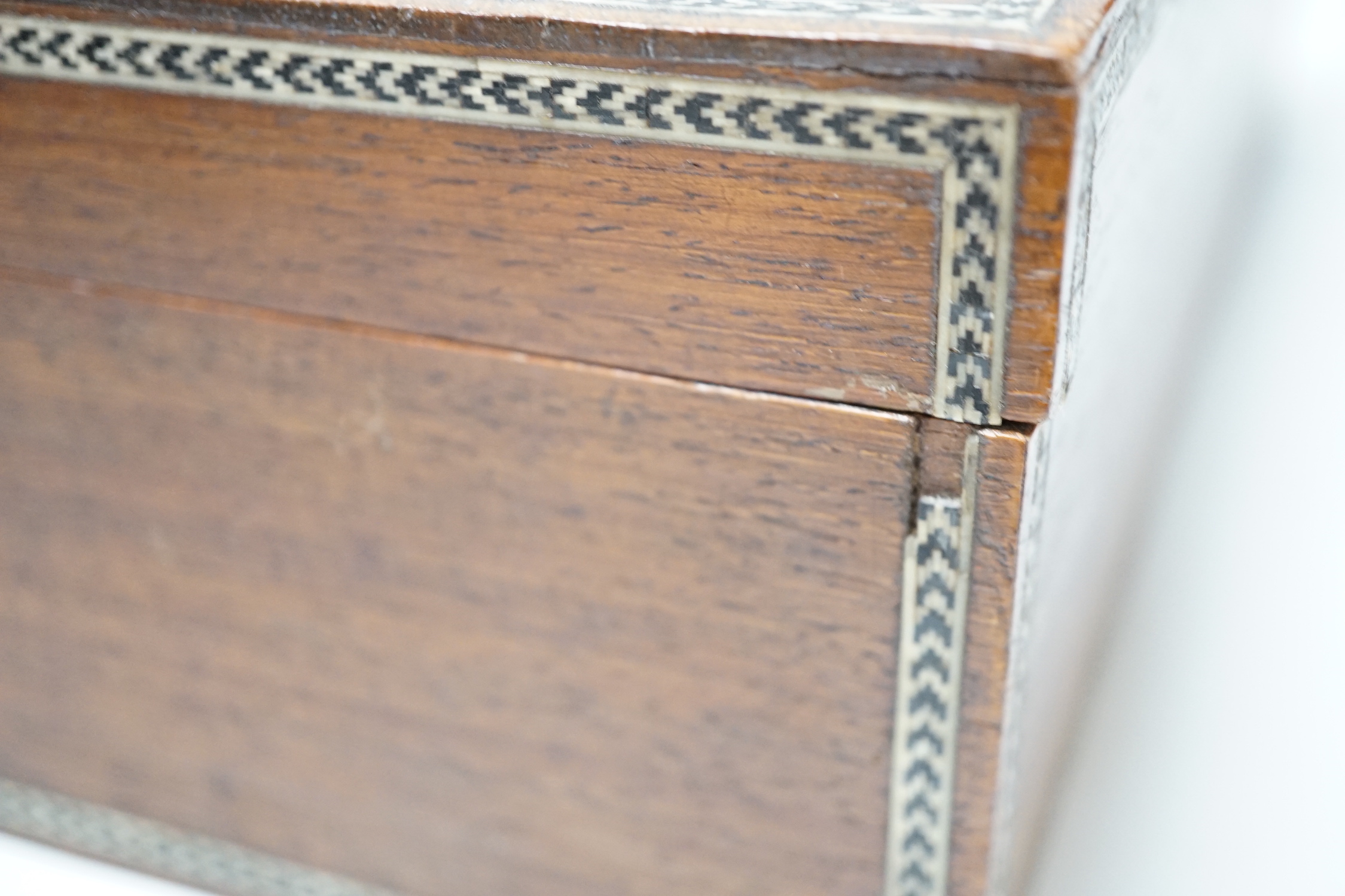 A Damascus jewellery casket, 30.5cm wide, 10cm high